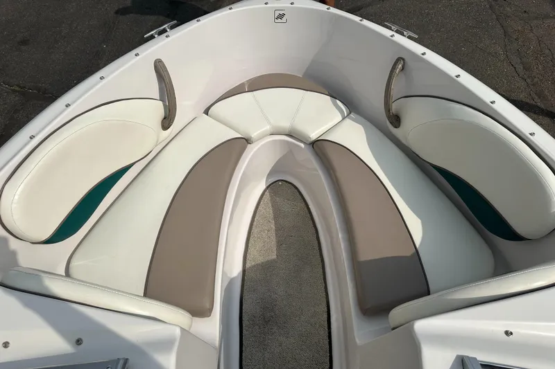 Slide: The Image of 1997 Four Winns Horizon QX boat interior with cushioned seating. - 10