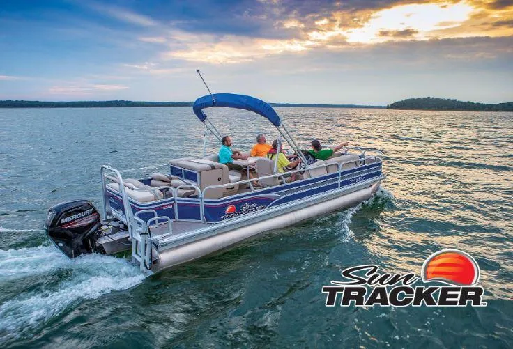Slide: The Image of 2015 Sun Tracker Fishing Barge 24 on a serene lake at sunset. - 6