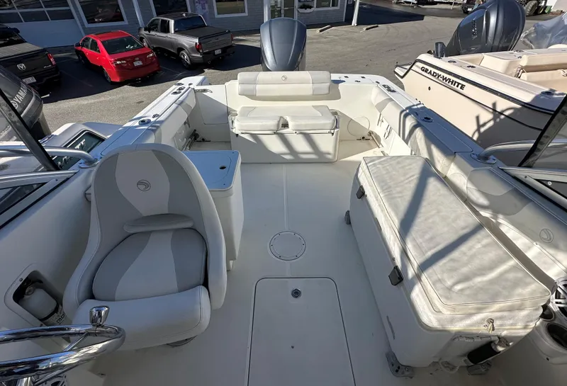 Slide: The Image of 2011 Edgewater 245 CX boat interior with seating and storage compartments. - 7