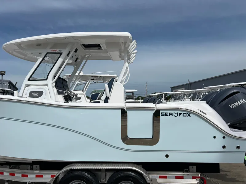 Slide: The Image of 2025 Sea Fox 288 Commander boat on trailer, side view, with Yamaha engine. - 1
