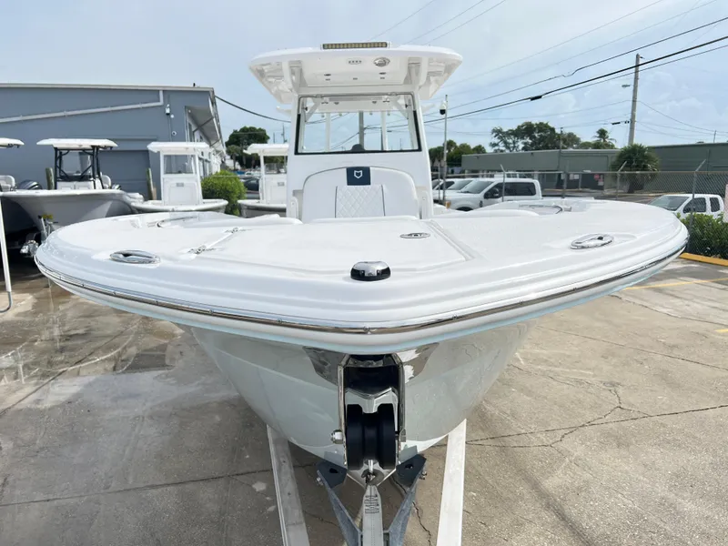 Slide: The Image of 2025 Sea Fox 288 Commander boat, front view, displayed outdoors on concrete. - 11