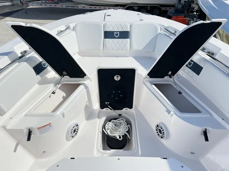 Slide: The Image of 2025 Sea Fox 288 Commander boat interior with open storage compartments and seating. - 20