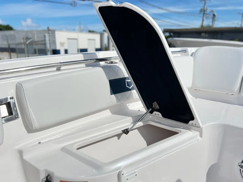 Slide: The Image of 2025 Sea Fox 288 Commander boat storage compartment with open lid, showcasing interior space. - 21