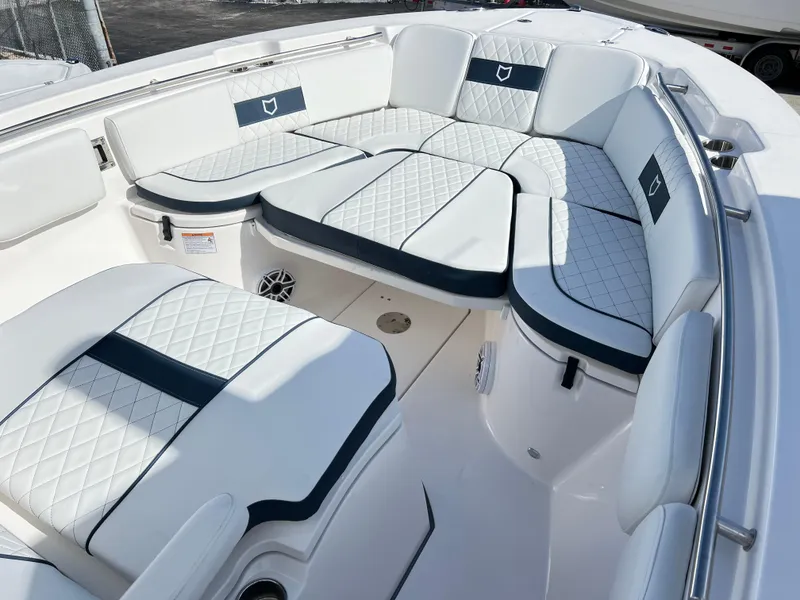 Slide: The Image of Luxurious seating area on 2025 Sea Fox 288 Commander boat with white and navy upholstery. - 24