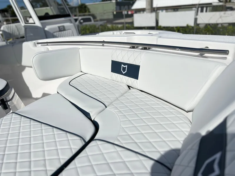 Slide: The Image of Luxurious seating on 2025 Sea Fox 288 Commander boat with quilted white upholstery. - 27