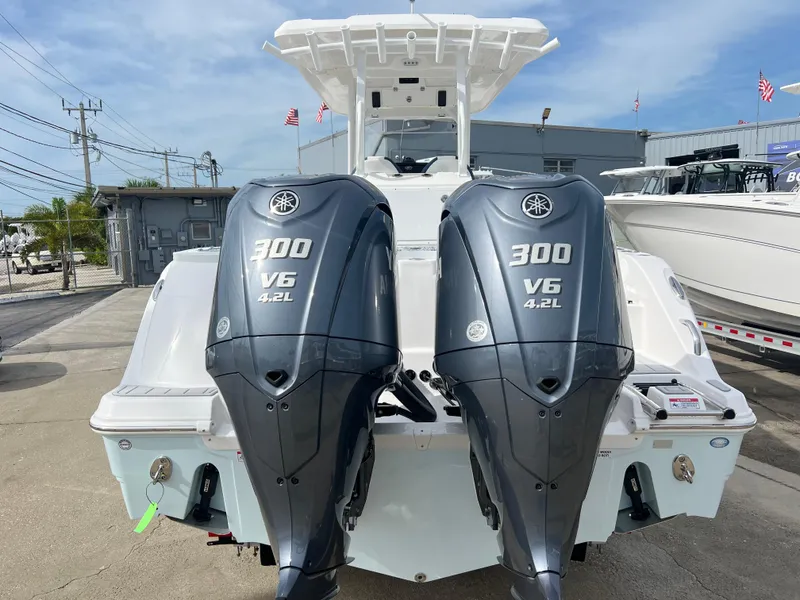 Slide: The Image of 2025 Sea Fox 288 Commander with twin 300 V6 engines, docked outdoors. - 3