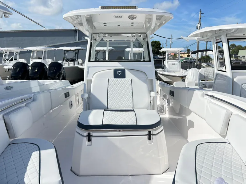 Slide: The Image of 2025 Sea Fox 288 Commander boat interior with white seating and modern design. - 33