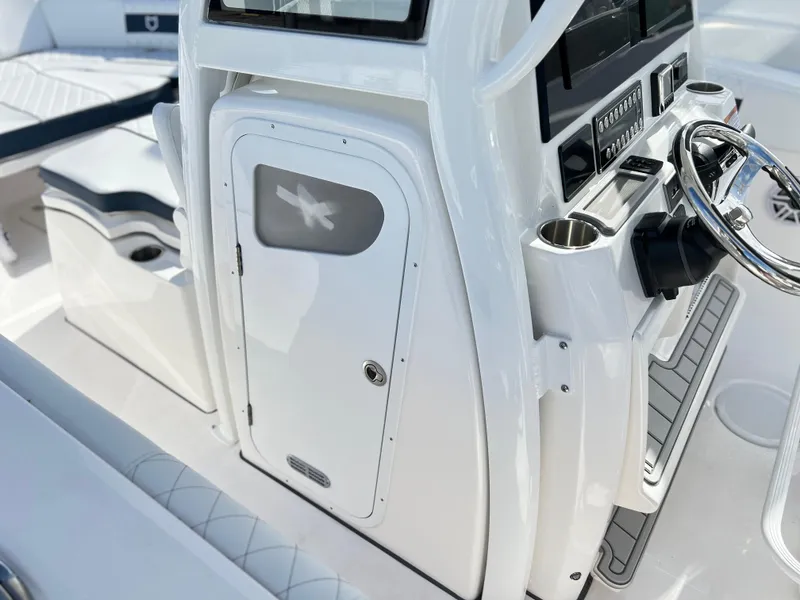 Slide: The Image of 2025 Sea Fox 288 Commander boat console with steering wheel and control panel. - 35