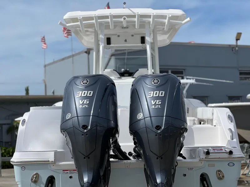 Slide: The Image of 2025 Sea Fox 288 Commander with twin Yamaha 300 V6 engines, docked outdoors. - 4