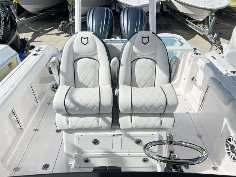 Slide: The Image of 2025 Sea Fox 288 Commander boat with luxurious dual captain's chairs and sleek design. - 40