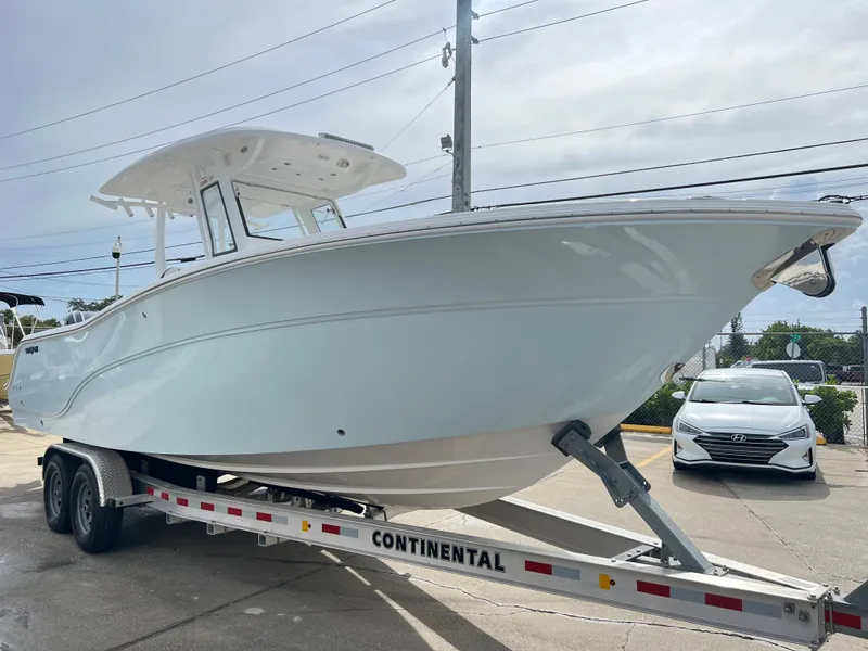 Slide: The Image of 2025 Sea Fox 288 Commander boat on trailer, parked outdoors. - 9