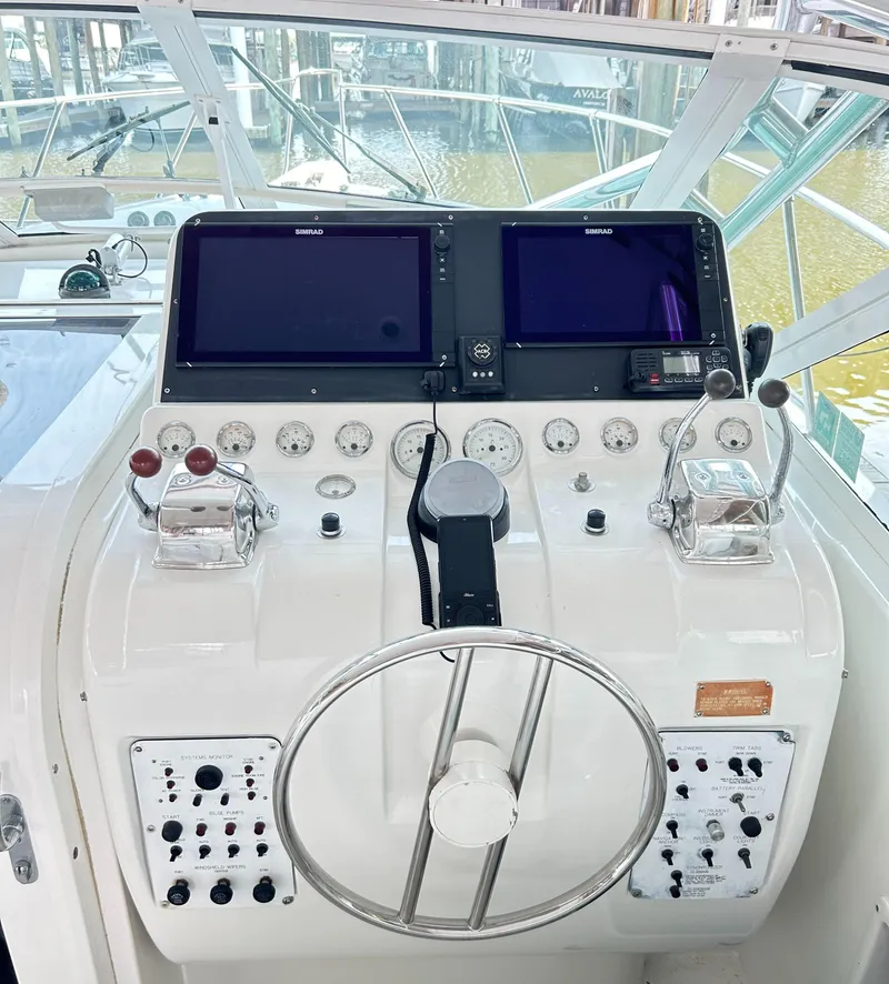 Slide: The Image of 1996 Hatteras 39 Sport Express helm with dual screens and controls. - 35