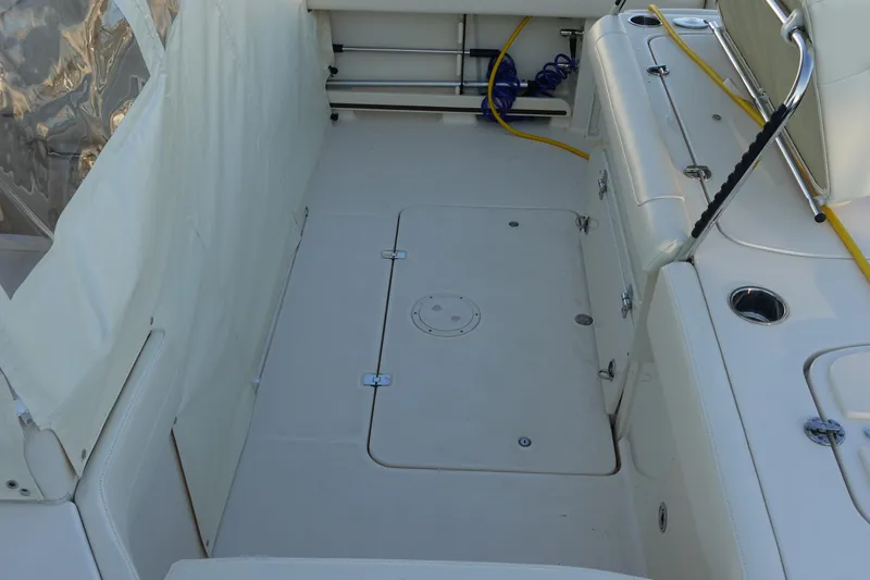 Slide: The Image of 2021 Grady-White Freedom 325 boat interior with clean deck and storage compartments. - 14