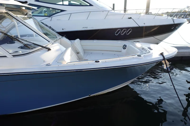 Slide: The Image of 2021 Grady-White Freedom 325 boat docked, featuring sleek design and spacious seating. - 4