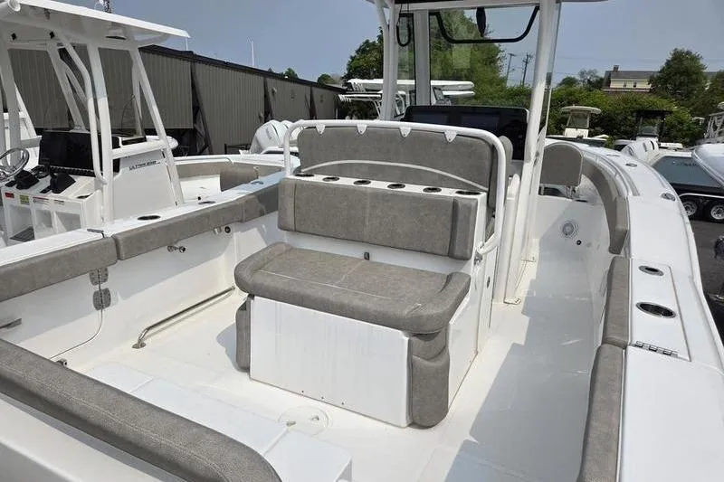 Slide: The Image of 2025 Sea Hunt Ultra 275 SE boat interior with cushioned seating and modern design. - 11
