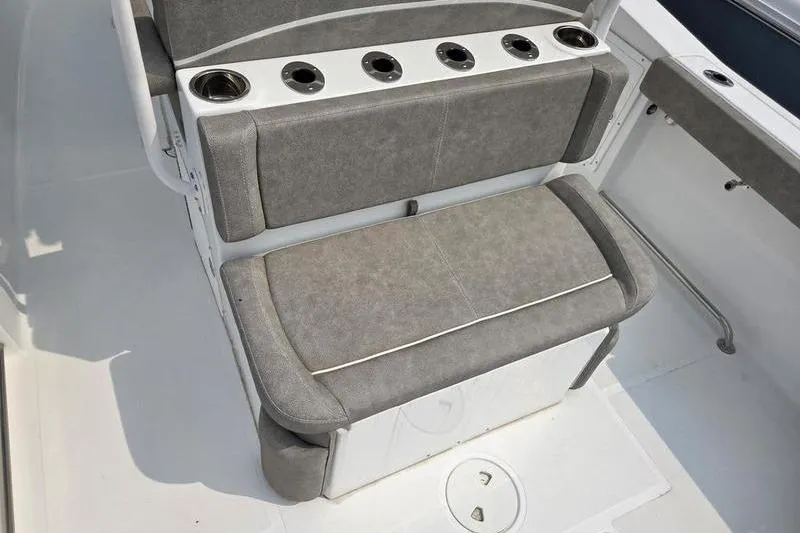 Slide: The Image of Gray seating area on 2025 Sea Hunt Ultra 275 SE boat with cup holders. - 15