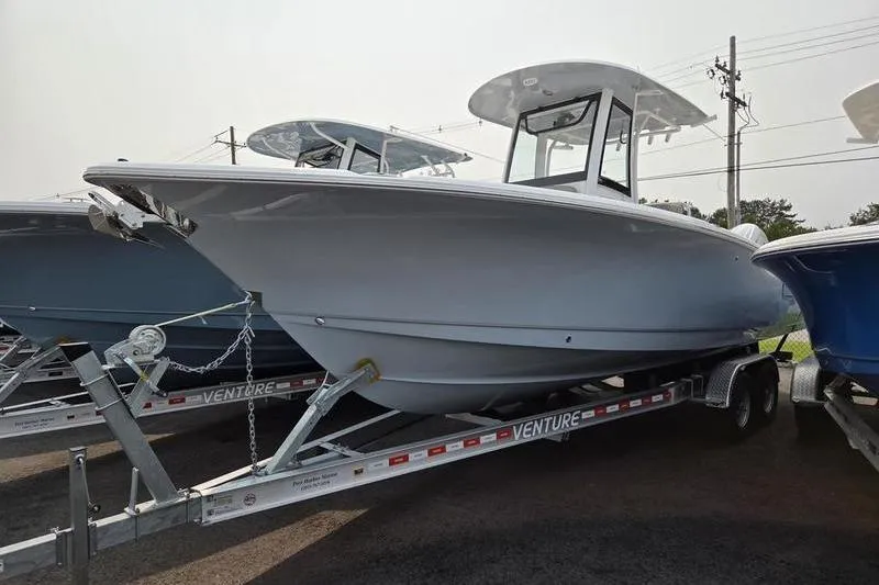 Slide: The Image of 2025 Sea Hunt Ultra 275 SE boat on trailer, side view. - 2