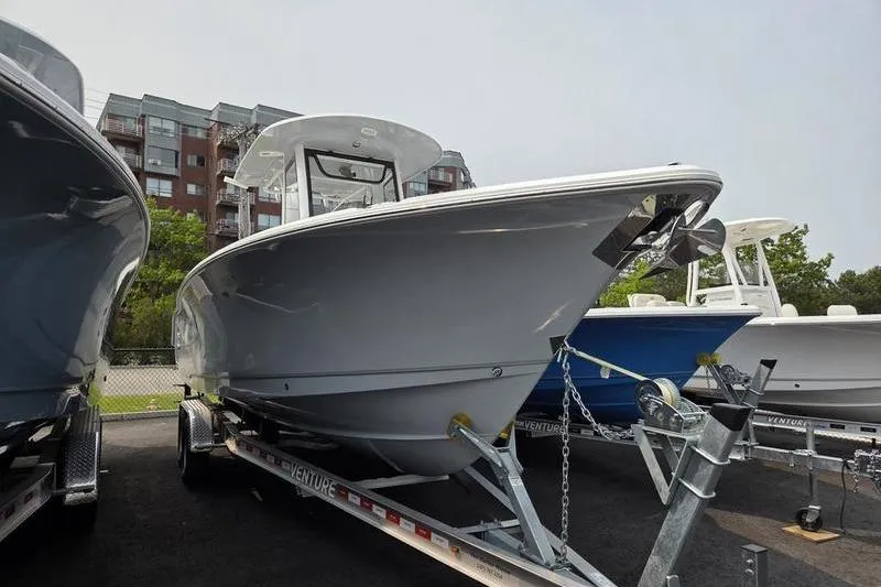 Slide: The Image of 2025 Sea Hunt Ultra 275 SE boat on trailer, displayed outdoors. - 4