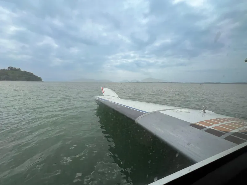 Slide: The Image of Wing of Aron M 80 aircraft over water, cloudy sky, 2025 model. - 14