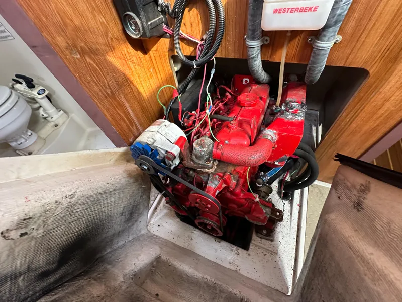 Slide: The Image of Catalina 380 1998 engine compartment with red Westerbeke engine. - 11