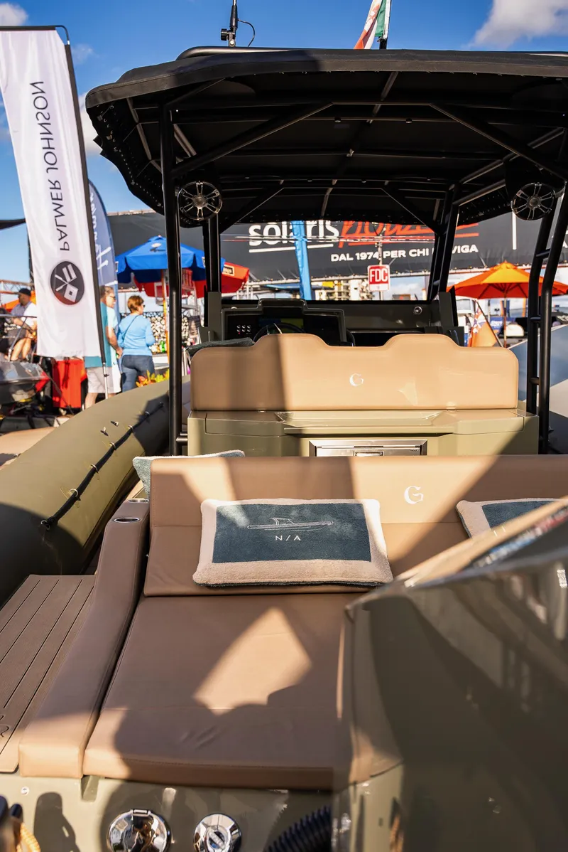 Slide: The Image of 2024 G-Tender DIECI luxury boat at a vibrant outdoor exhibition. - 17