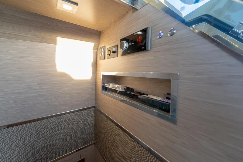 Slide: The Image of 2024 G-Tender DIECI interior with modern control panel and sleek wooden finish. - 21