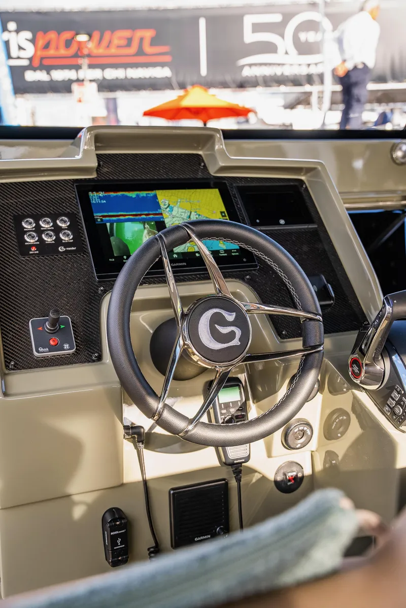Slide: The Image of 2024 G-Tender DIECI dashboard with steering wheel and digital display. - 25