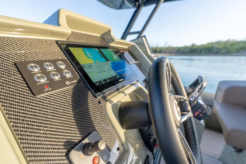 Slide: The Image of 2024 G-Tender DIECI boat dashboard with steering wheel and navigation display. - 27