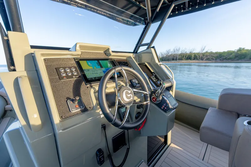 Slide: The Image of 2024 G-Tender DIECI boat dashboard with advanced navigation system and steering wheel. - 28