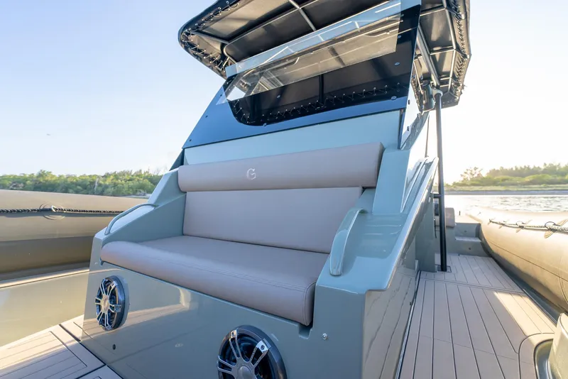 Slide: The Image of 2024 G-Tender DIECI boat with cushioned seating and sleek design on a sunny day. - 37