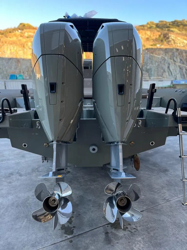 Slide: The Image of 2024 G-Tender DIECI boat with dual outboard motors and propellers, docked outdoors. - 41