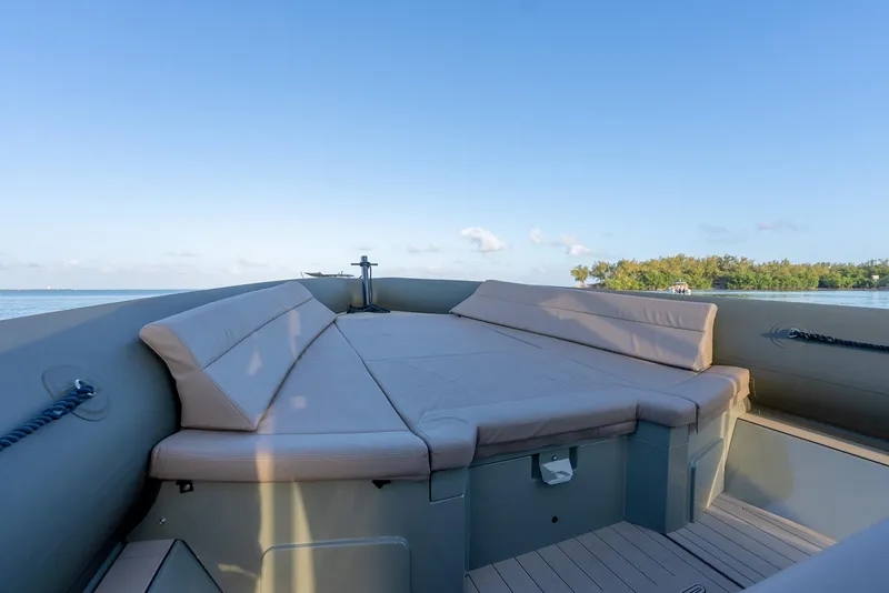 Slide: The Image of 2024 G-Tender DIECI boat with cushioned seating, ocean view, and clear sky. - 43