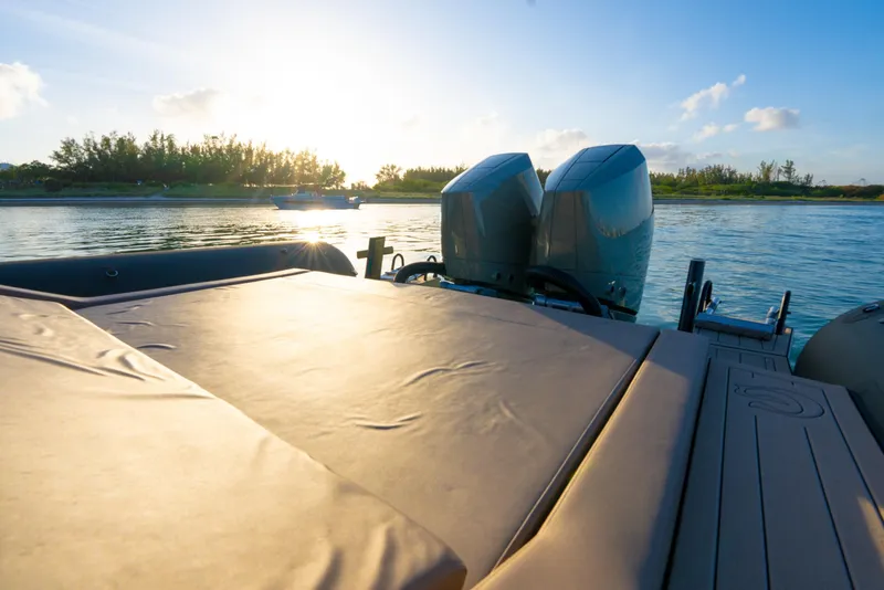 Slide: The Image of 2024 G-Tender DIECI boat with dual engines on a serene waterway at sunset. - 46