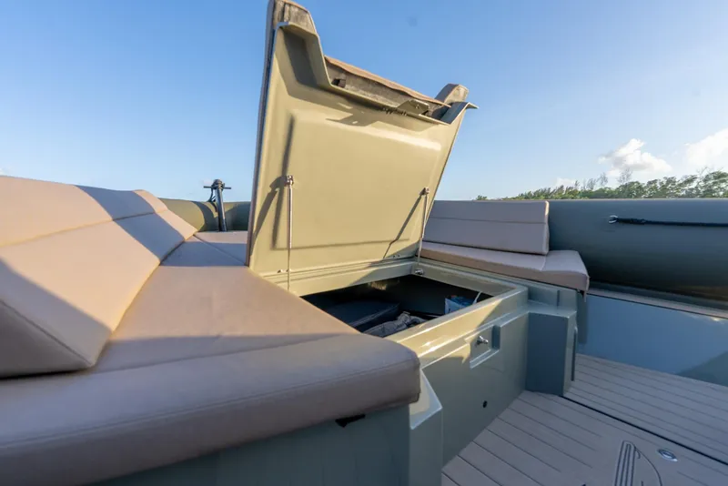 Slide: The Image of 2024 G-Tender DIECI boat with open storage compartment and cushioned seating. - 47