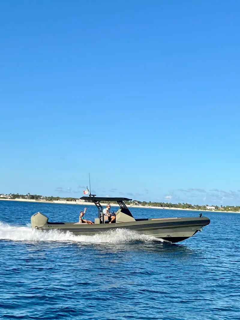 Slide: The Image of 2024 G-Tender DIECI boat cruising on clear blue water under a sunny sky. - 5
