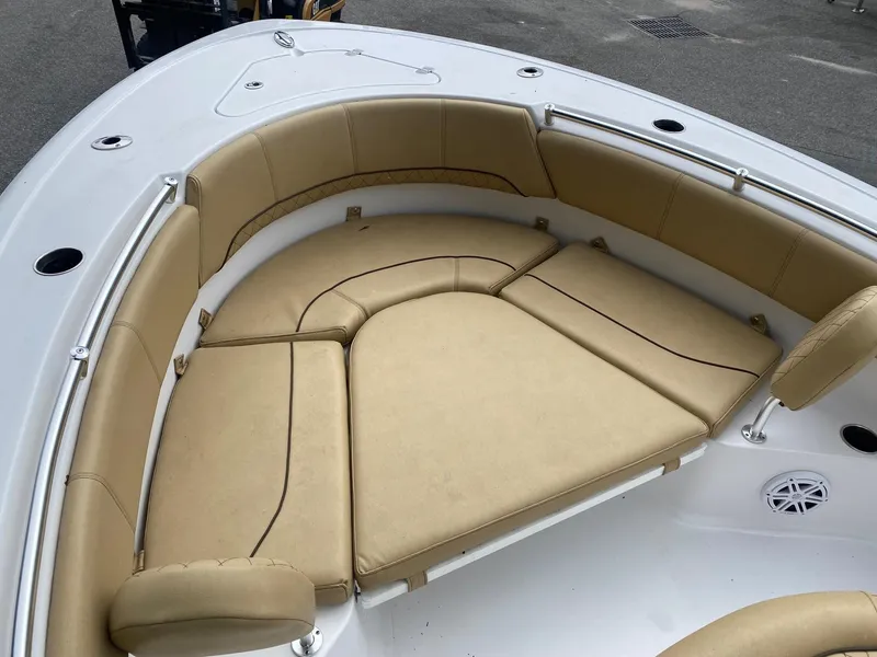 Slide: The Image of 2022 Sportsman Heritage 231 boat with tan cushioned seating in bow area. - 4