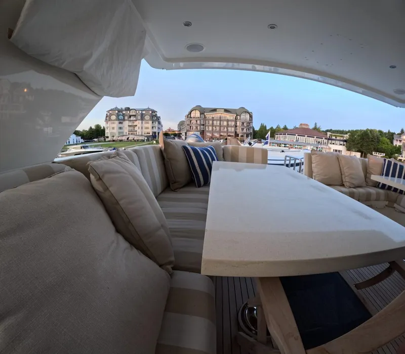 Slide: The Image of Luxurious seating area on 2007 Hargrave 93' yacht with scenic waterfront view. - 14