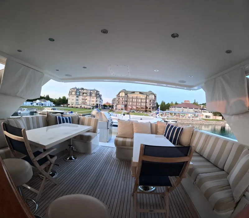 Slide: The Image of Luxurious 2007 Hargrave yacht interior with elegant seating and scenic marina view. - 15