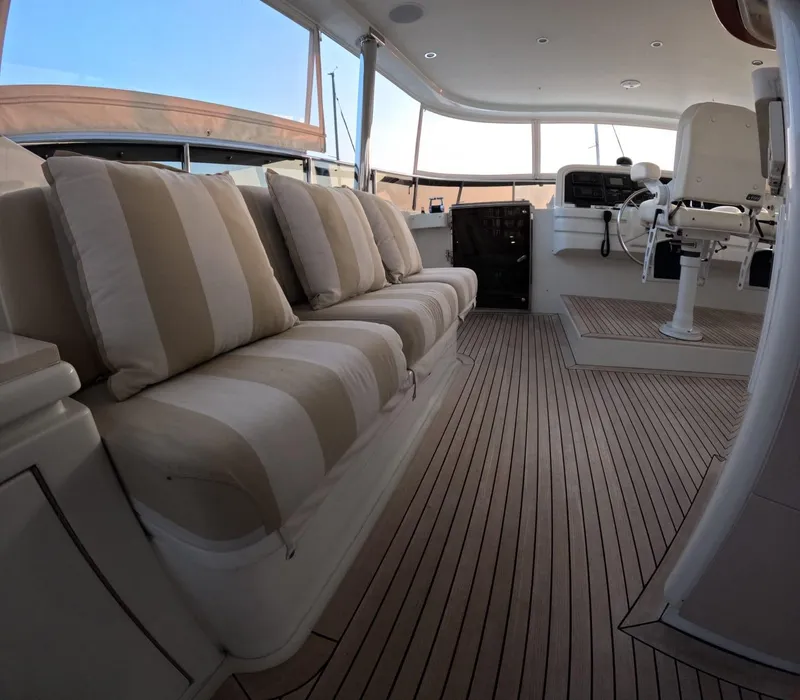 Slide: The Image of Luxurious 2007 Hargrave yacht interior with striped seating and elegant wood flooring. - 18