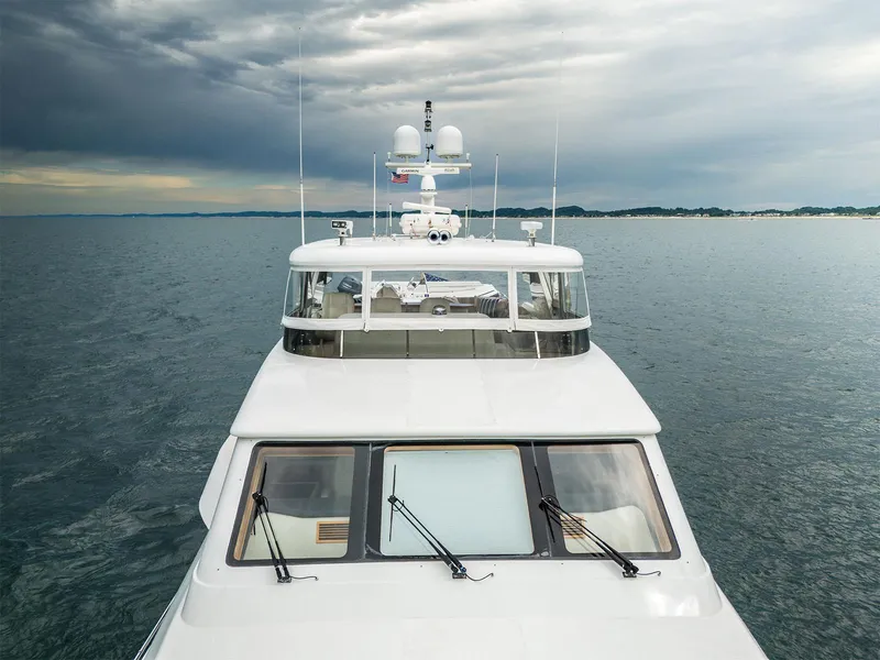 Slide: The Image of Hargrave 93' yacht from 2007 cruising on calm waters under a cloudy sky. - 2