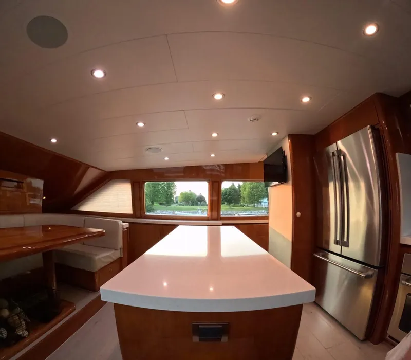 Slide: The Image of Luxurious kitchen interior of 2007 Hargrave 93' yacht with modern appliances and seating area. - 24