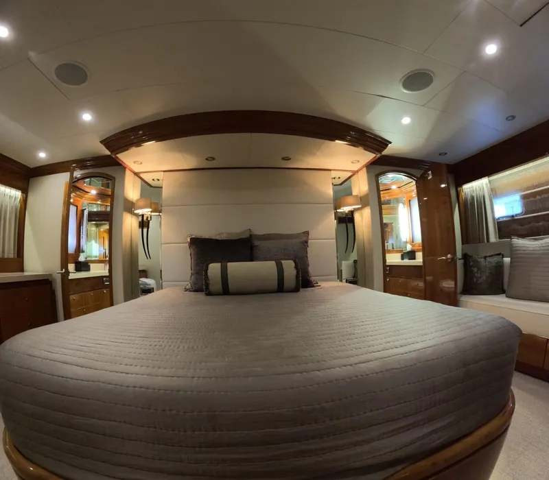 Slide: The Image of Luxurious bedroom interior of 2007 Hargrave 93' yacht with elegant wood accents. - 27