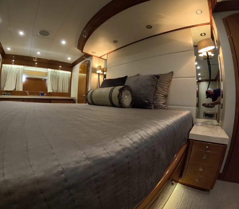Slide: The Image of Luxurious bedroom interior of 2007 Hargrave 93' yacht with elegant bedding and lighting. - 28