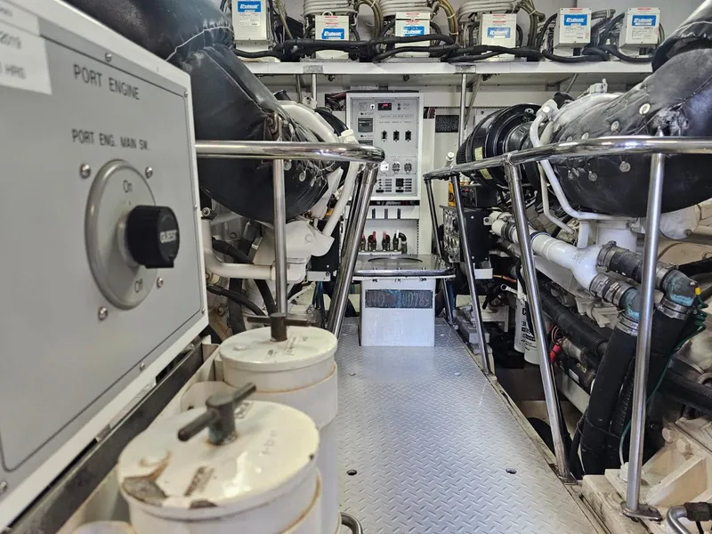 Slide: The Image of Engine room of 2007 Hargrave 93' yacht, showcasing machinery and control panels. - 37