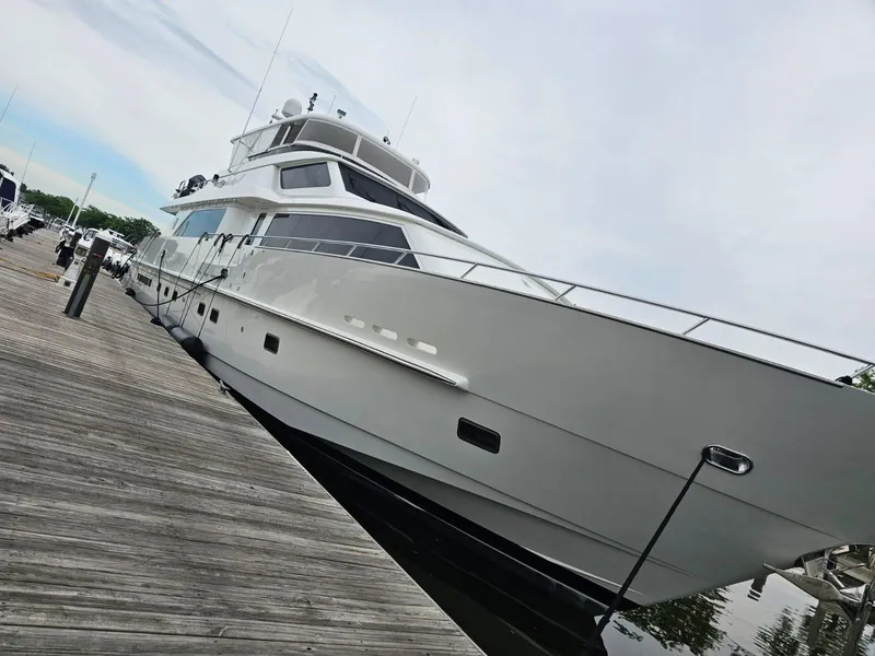 Slide: The Image of Luxury 2007 Hargrave 93' yacht docked at marina, sleek design. - 4