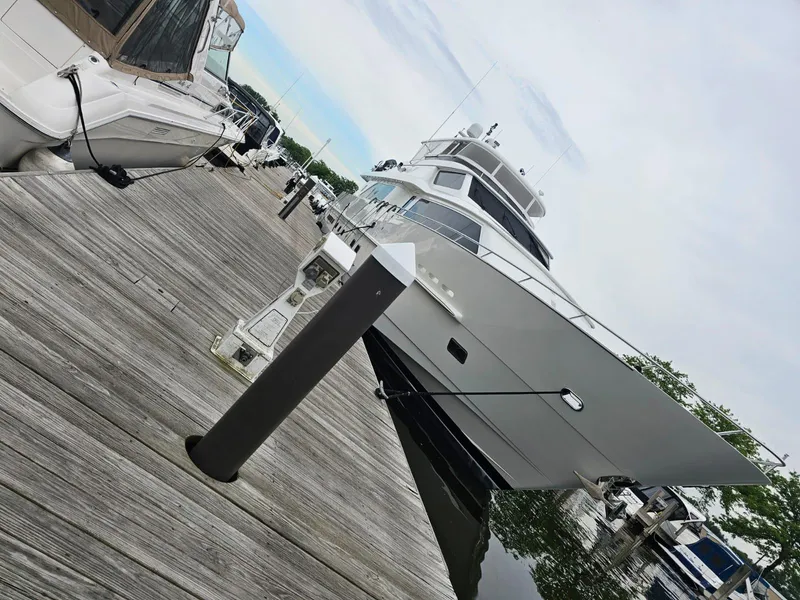 Slide: The Image of Luxury 2007 Hargrave yacht docked at marina, showcasing sleek design and elegance. - 5