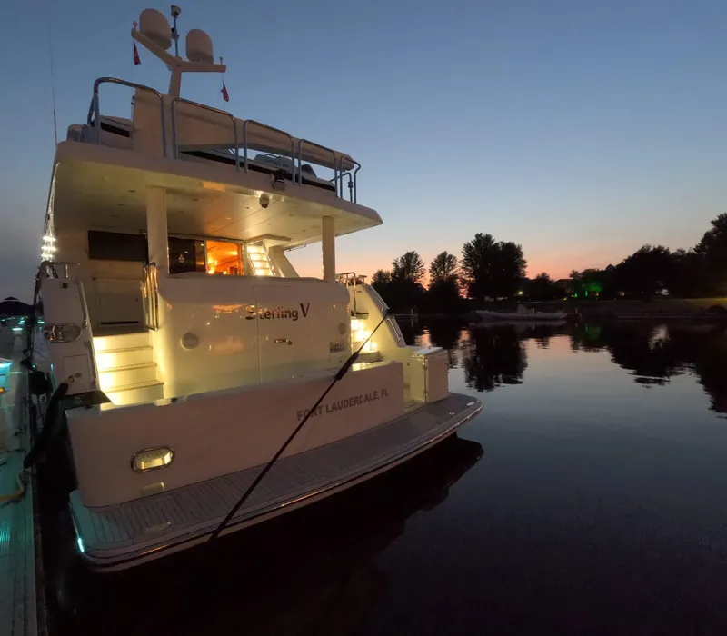 Slide: The Image of Luxury Hargrave yacht at sunset, docked on calm water, 2007 model. - 7
