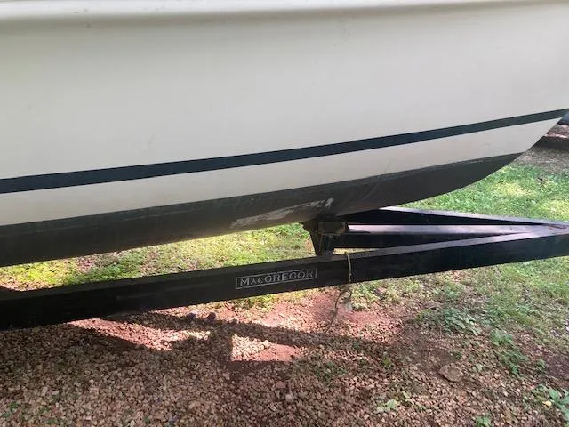 Slide: The Image of 1997 MacGregor 26 X boat on trailer, side view, outdoors. - 4