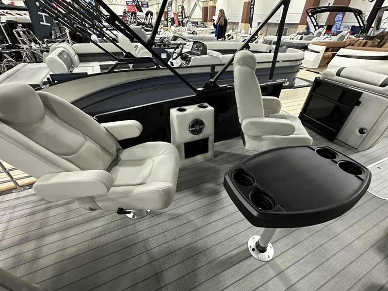 Slide: The Image of 2024 Starcraft EXS 3 HB4TT boat interior with swivel seats and table, showcasing luxury design. - 12