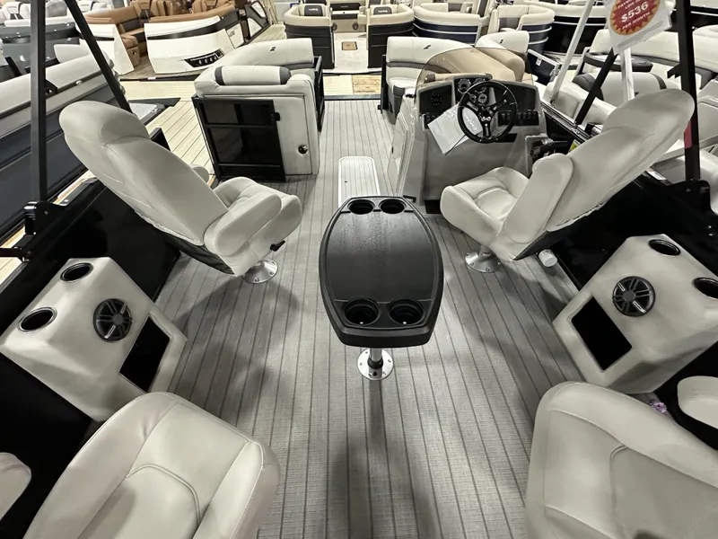 Slide: The Image of 2024 Starcraft EXS 3 HB4TT boat interior with plush seating and modern dashboard. - 13